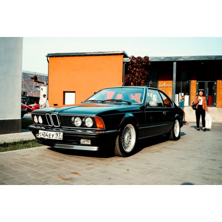 Black Sedan Parked Near Brown Building 24"x16" Photographic Print Poster