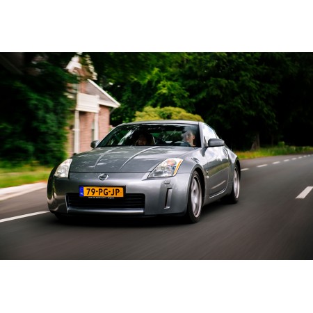 Silver Nissan driven by woman 24"x16" Photo Print Poster