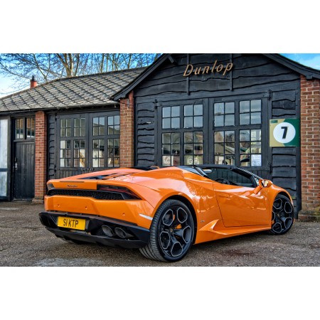 Orange Lamborghini Parked In Front of Dunlop 24"x16" Photo Print Poster
