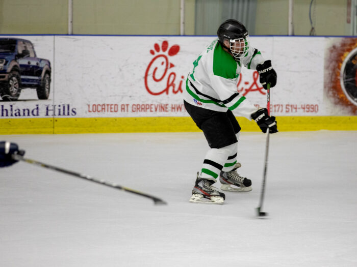 Hockey Player On Ice Court Photographic Print Poster