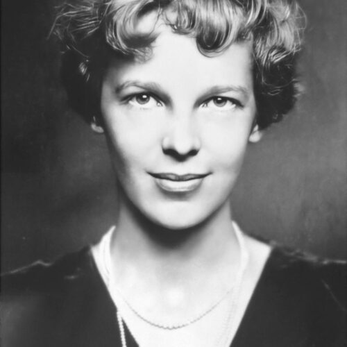 Vintage photo poster of Amelia Earhart, the aviation pioneer, wearing 1930s evening clothes