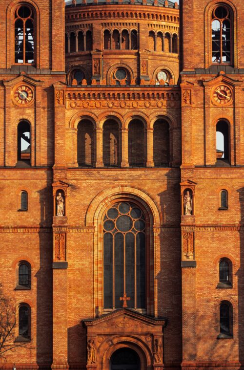 Historic Brick Church Facade Wall Art – Architectural Photography Print Featuring Neo-Romanesque Details and Sunset Light picture