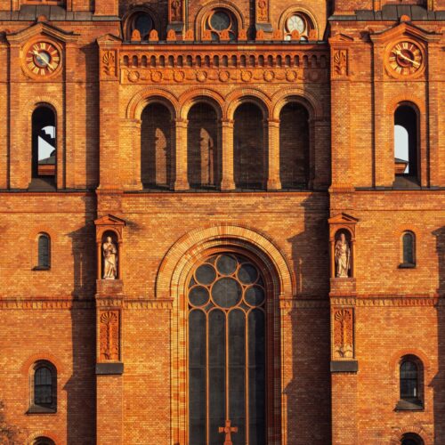 Historic Brick Church Facade Wall Art – Architectural Photography Print Featuring Neo-Romanesque Details and Sunset Light picture