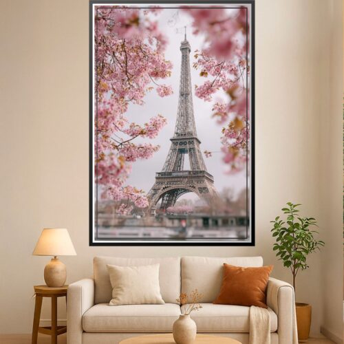 Photographic wall art of the Eiffel Tower framed by soft pink cherry blossoms in Paris during springtime.