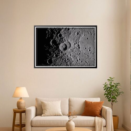 Close-up photographic wall art of the moon surface featuring detailed craters and dramatic high-contrast shadows.