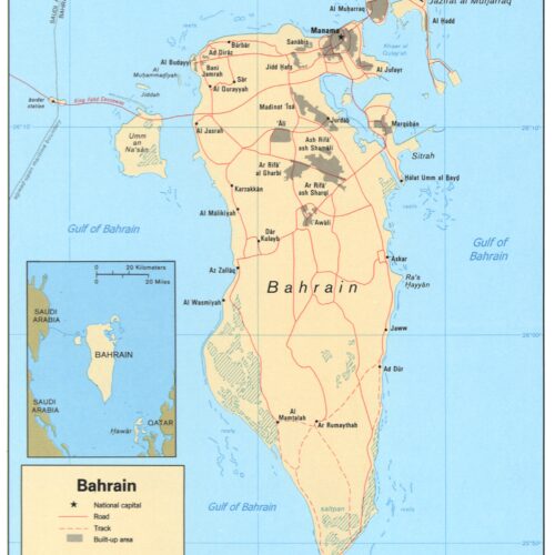 Political map of Bahrain showing cities, roads, and geographic boundaries with Persian Gulf, includes regional context inset of Saudi Arabia and Qatar.