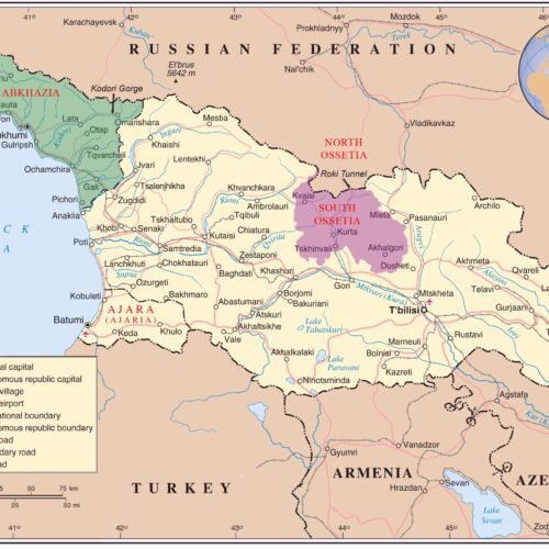 Political map of Georgia showing Abkhazia, South Ossetia, Ajara autonomous regions with neighboring Russia, Turkey, Armenia, and Azerbaijan, featuring cities, roads, and geographic borders.