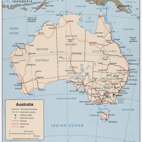 Political map of Australia showing state and territory boundaries, major cities, roads, railways, and surrounding oceans and nearby regions.