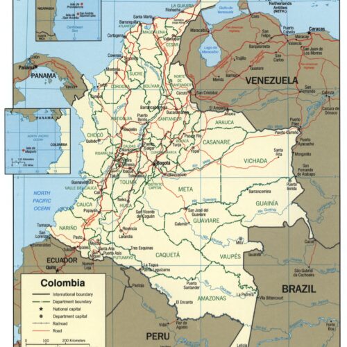 Political map of Colombia showing 32 departments, major cities, international borders with Venezuela, Brazil, Peru, Ecuador, and Panama, department boundaries, railroads, and road networks in cream and tan tones.
