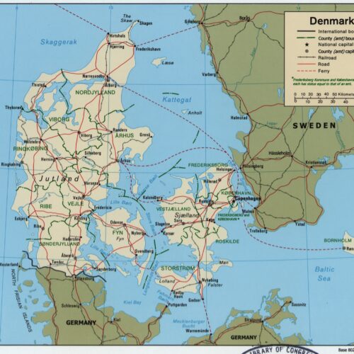 Political map of Denmark showing counties, major cities, railroads, roads, and ferry routes with legend and scale, bordered by North Sea, Baltic Sea, Germany, Sweden, and Poland.