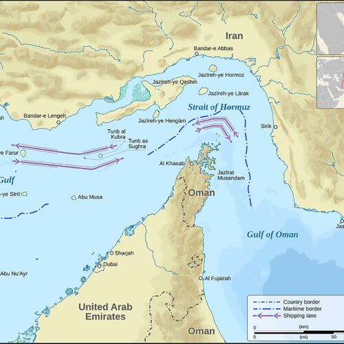 Nautical map of Strait of Hormuz showing shipping lanes, maritime borders, and cities in Iran, Oman, and United Arab Emirates with compass rose and scale.