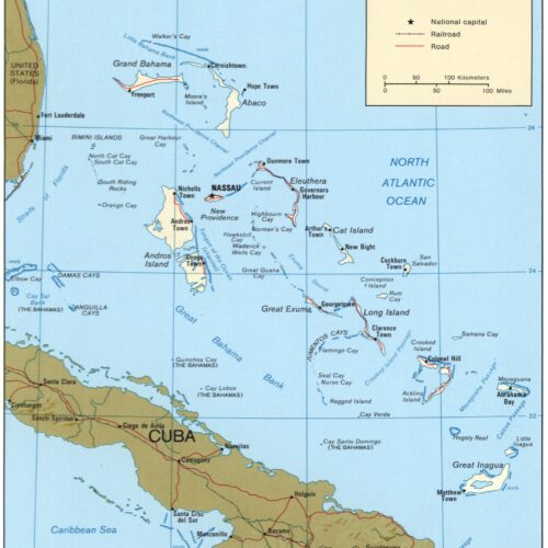 Detailed political map of The Bahamas showing islands, cays, towns, railroads, and roads with geographic reference markers and scale.