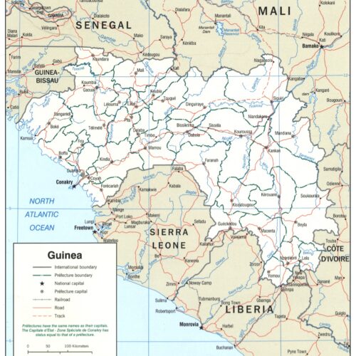 Political map of Guinea showing international boundaries, prefecture divisions, major cities, rivers, roads, and the North Atlantic Ocean coastline.