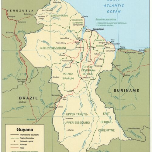 Political map of Guyana showing administrative regions, cities, rivers, and borders with Venezuela, Suriname, and Brazil in cream and green colors.