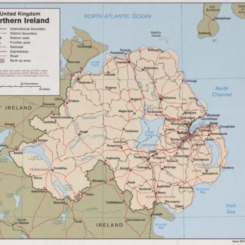 Political map of Northern Ireland showing district boundaries, cities, roads, expressways, and international borders with Ireland and Scotland.