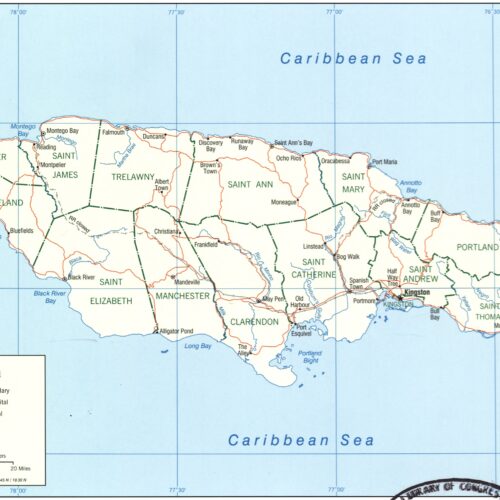 Political map of Jamaica showing parish boundaries, major cities, roads, railroads, and Caribbean Sea geography with clear labels and scale.