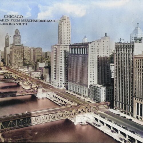 Vintage hand-tinted photograph of Chicago Wacker Drive skyline taken from Merchandise Mart looking south, featuring Art Deco skyscrapers and Chicago River bridges.