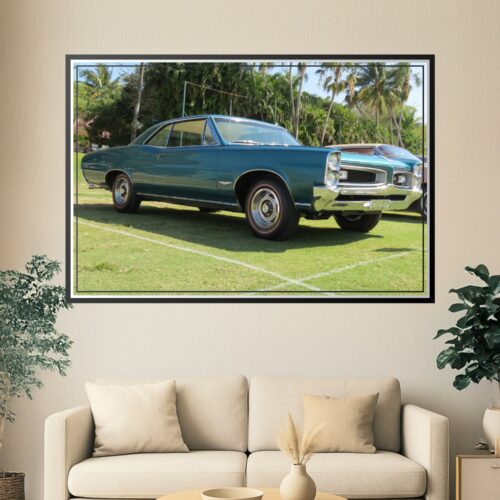 Photographic print of a turquoise 1966 Pontiac GTO muscle car displayed at a car show with chrome details and palm tree backdrop.