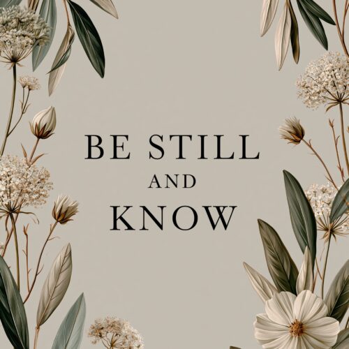Botanical wall art poster with delicate white flowers, sage green leaves, and inspirational text reading 'Be Still and Know' on soft neutral background.