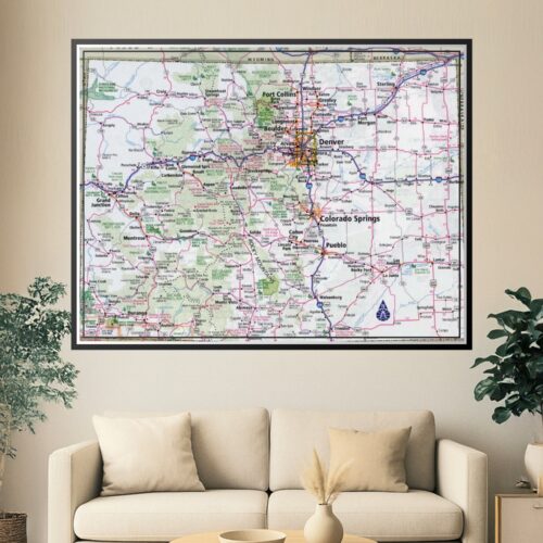 Detailed road map of Colorado showing highways, cities, mountains, national forests, and landmarks in classic cartographic style with pink and green coloring.