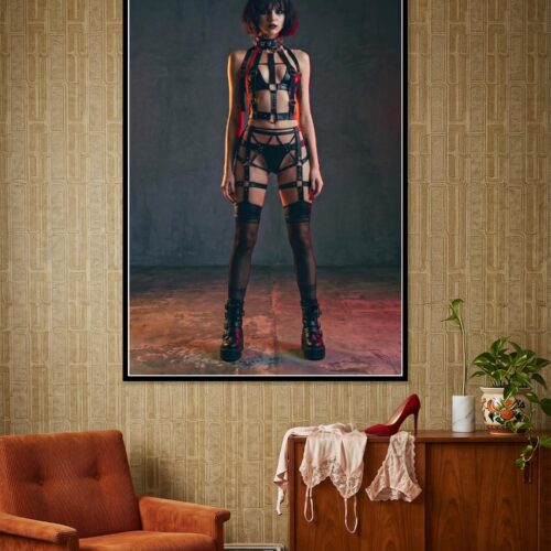 High-contrast portrait of a woman in gothic punk cyberpunk style wearing industrial harness and alternative fashion with teal and amber studio lighting on dark background.