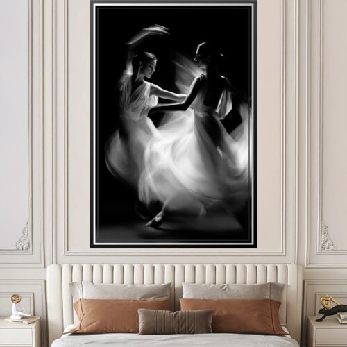 Black and white noir poster of two dancers moving in synchronized harmony with flowing fabrics dissolving into ethereal light against deep black background.