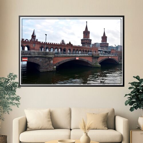 Photographic print of the Oberbaumbrücke, Berlin's iconic red brick bridge with twin neo-Gothic towers spanning the Spree River.
