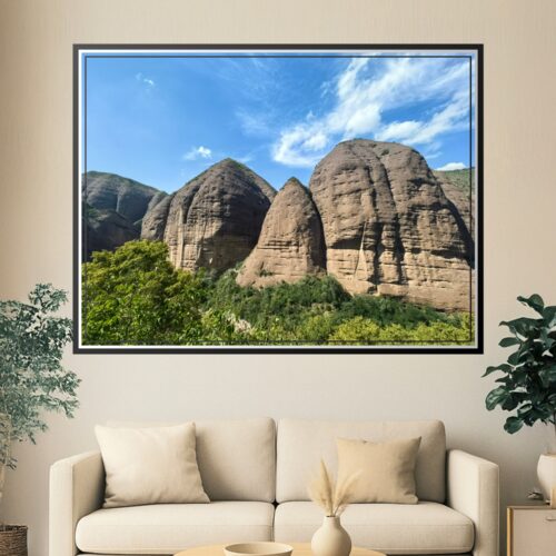 Photographic print of Shuiliandong Scenic Area featuring massive sandstone rock formations against blue sky with green vegetation below.