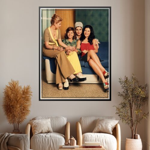 Vintage photograph of four Iranian actresses from the 1960s-70s era sitting together on a blue couch, wearing period costumes and jewelry, embodying mid-century glamour and cultural sophistication.