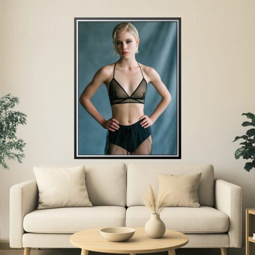 Elegant minimalist portrait of a model in black attire against a muted background, modern art style suitable for home or office decor.