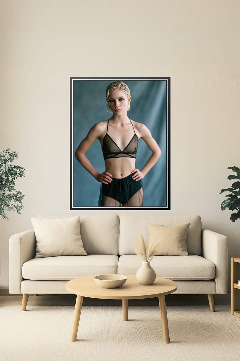 Elegant minimalist portrait of a model in black attire against a muted background, modern art style suitable for home or office decor.